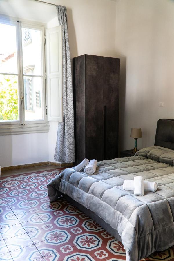 Camera Quadrupla con Bagno in Comune e Balcone